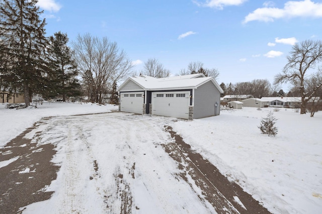 view of snow covered garage