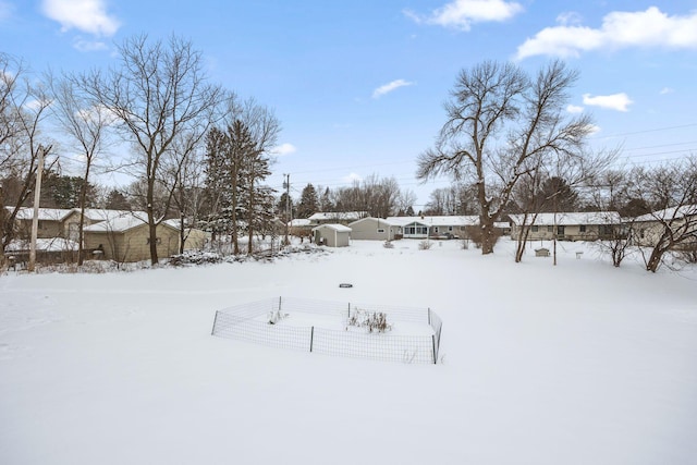 view of yard layered in snow