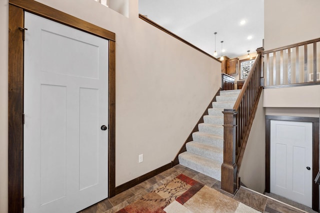 stairs featuring crown molding