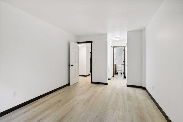 unfurnished room with light hardwood / wood-style floors