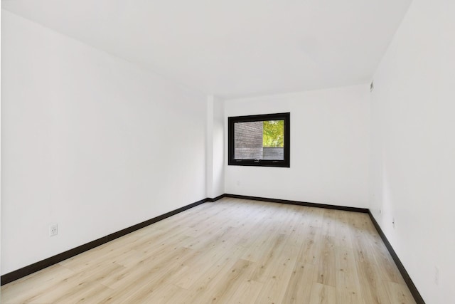 unfurnished room featuring light wood-type flooring