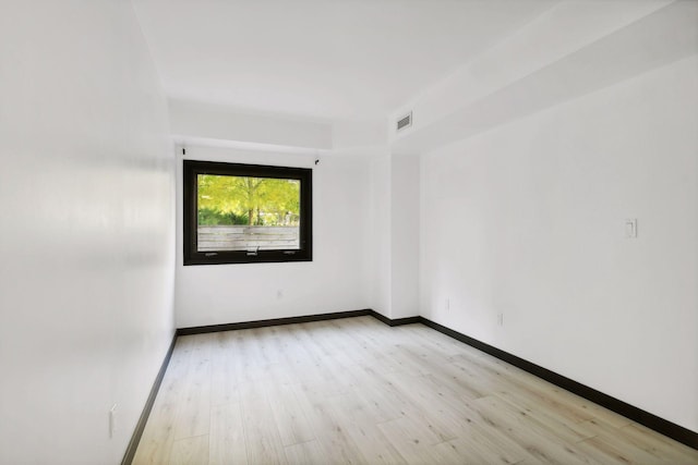 unfurnished room featuring light hardwood / wood-style flooring