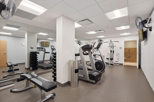 workout area with a drop ceiling