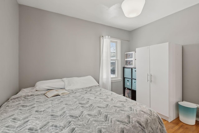 bedroom featuring light hardwood / wood-style floors and a closet