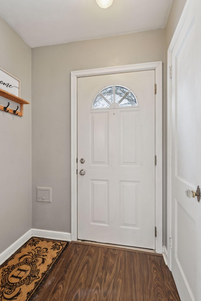 foyer with dark hardwood / wood-style floors