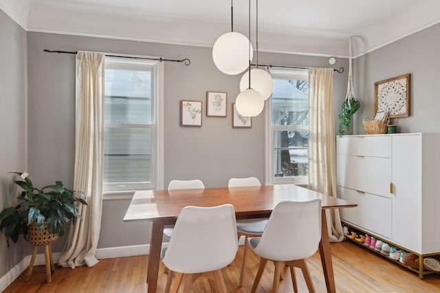 dining space featuring light wood-type flooring