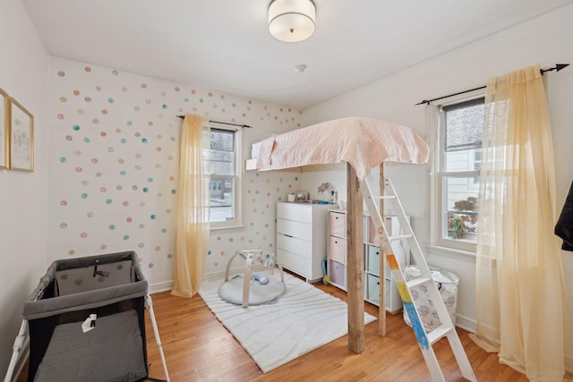 bedroom with hardwood / wood-style floors