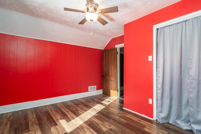 109 3rd St E, Ada, MN 56510 - spare room with wood finished floors, ceiling fan, vaulted ceiling, baseboards, and a textured ceiling