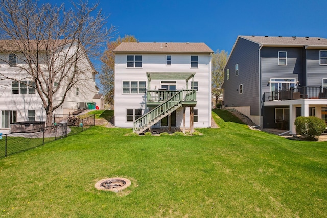 6789 Troy Ln N, Maple Grove, MN 55311 - rear view of house with stairs, a deck, and a fire pit