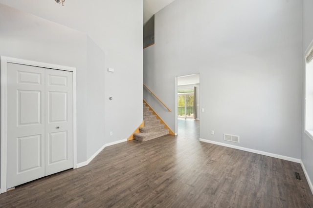 6789 Troy Ln N, Maple Grove, MN 55311 - unfurnished living room featuring wood finished floors, baseboards, and stairs