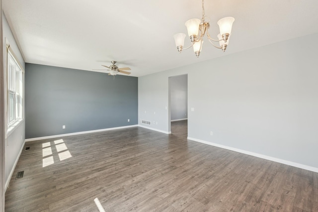 6789 Troy Ln N, Maple Grove, MN 55311 - empty room featuring a ceiling fan, a chandelier, wood finished floors, and baseboards