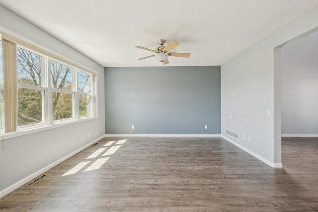6789 Troy Ln N, Maple Grove, MN 55311 - unfurnished room featuring ceiling fan, wood finished floors, and baseboards