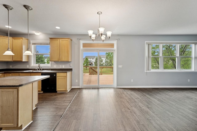 6789 Troy Ln N, Maple Grove, MN 55311 - kitchen with black dishwasher, dark countertops, a sink, light brown cabinetry, and a chandelier