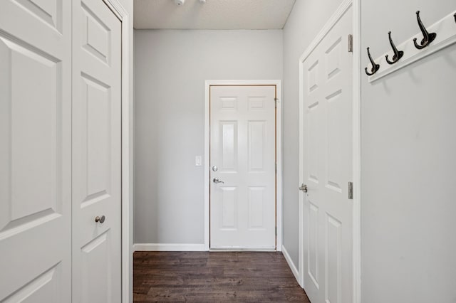 6789 Troy Ln N, Maple Grove, MN 55311 - hall featuring dark wood-type flooring and baseboards