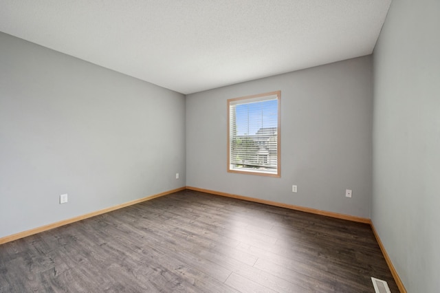 6789 Troy Ln N, Maple Grove, MN 55311 - empty room featuring baseboards and wood finished floors