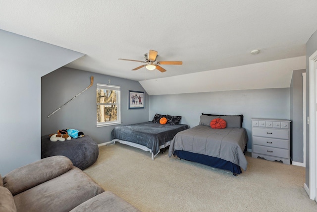 bedroom featuring ceiling fan, a textured ceiling, light colored carpet, and lofted ceiling