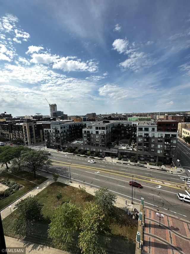 birds eye view of property featuring a city view