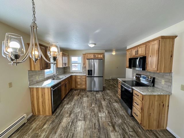 kitchen featuring brown cabinetry, appliances with stainless steel finishes, baseboard heating, and dark wood-type flooring