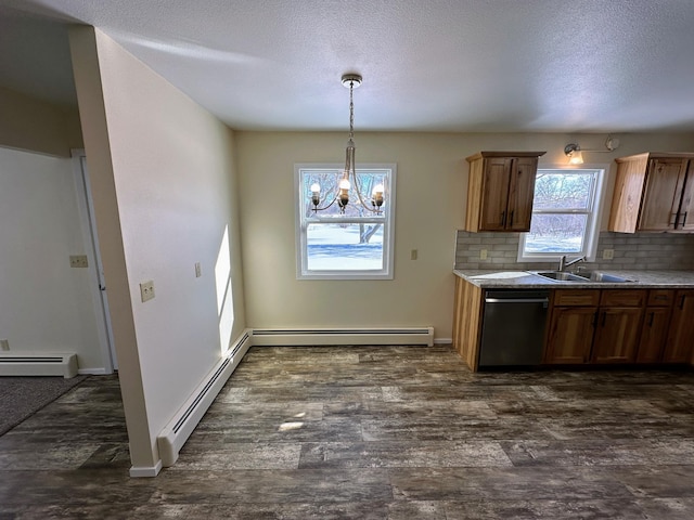 kitchen featuring dishwasher, a baseboard radiator, and dark wood finished floors