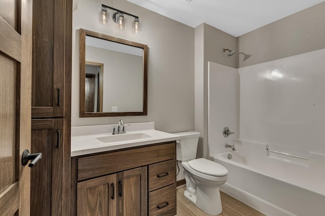 full bathroom with shower / bathing tub combination, vanity, and toilet