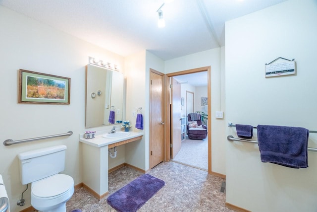 bathroom with sink and toilet