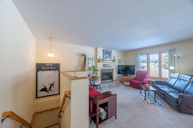 carpeted living room with a textured ceiling