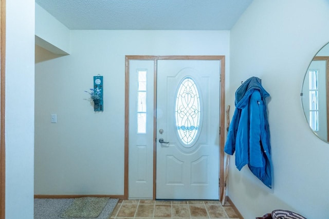 entrance foyer with a textured ceiling