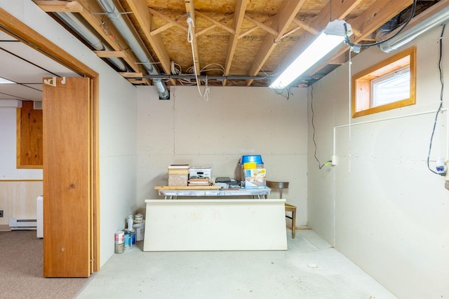 basement featuring a baseboard radiator