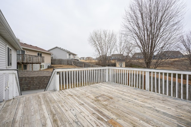 wooden terrace featuring fence