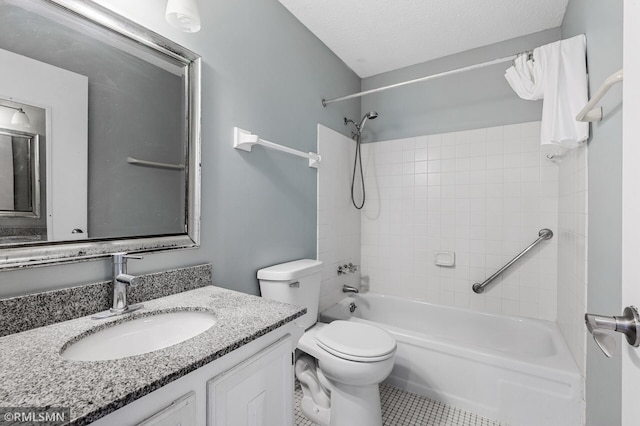 full bathroom with tiled shower / bath combo, vanity, toilet, tile patterned floors, and a textured ceiling