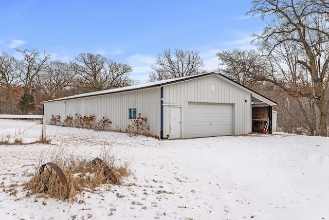 view of snow covered garage