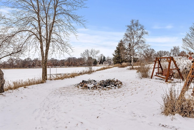 view of yard layered in snow