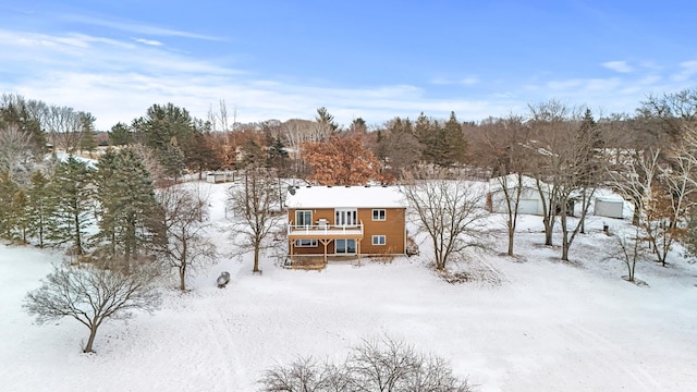 view of snow covered house