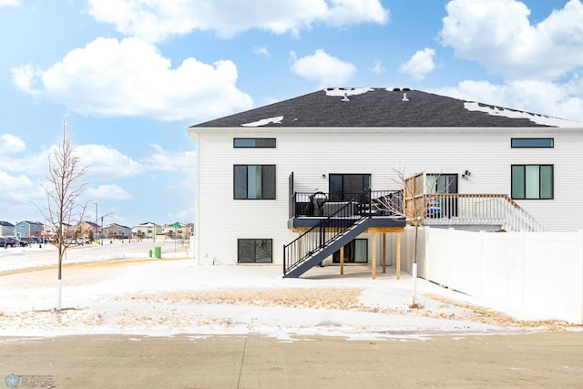 back of house with a wooden deck