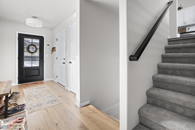 entryway with light hardwood / wood-style floors