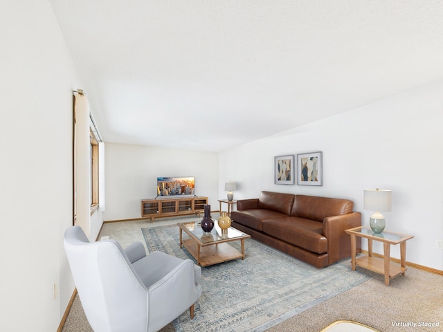 carpeted living room featuring baseboards