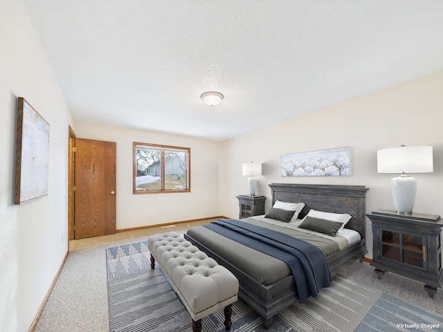 carpeted bedroom featuring baseboards