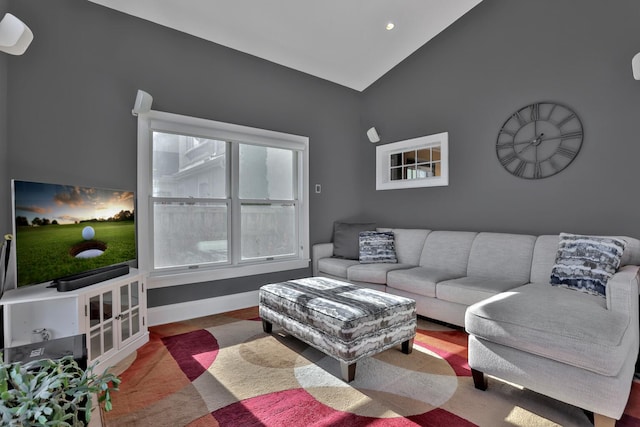 living room featuring vaulted ceiling