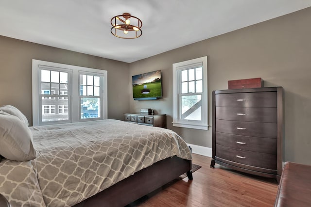 bedroom with wood-type flooring