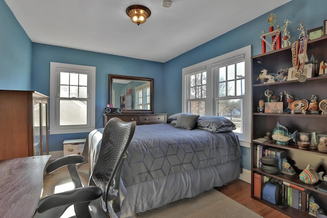 bedroom featuring dark wood-type flooring