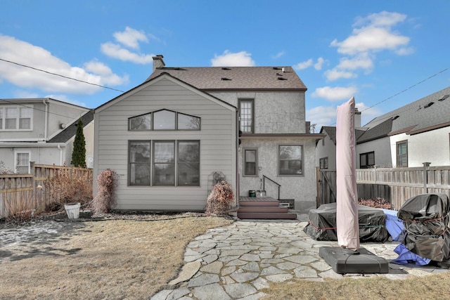 rear view of house with a patio