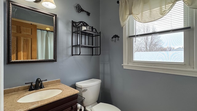 bathroom with vanity and toilet