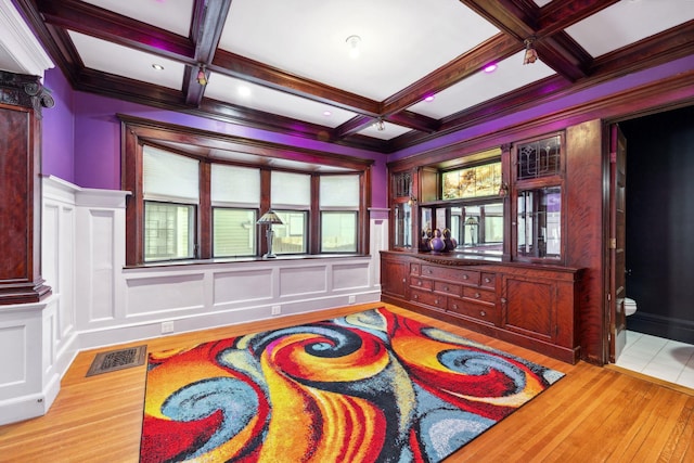 playroom with coffered ceiling, visible vents, a decorative wall, and beamed ceiling