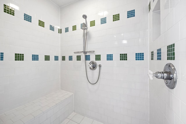 bathroom with tiled shower