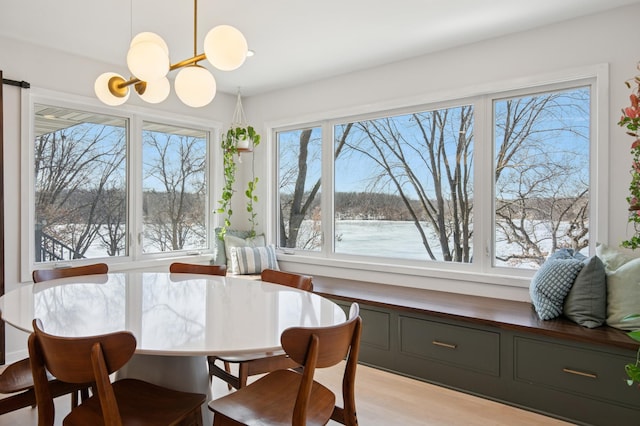 dining room featuring an inviting chandelier and wood finished floors