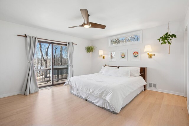 bedroom featuring a ceiling fan, visible vents, baseboards, light wood-style floors, and access to outside