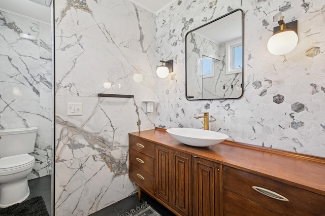 bathroom featuring toilet and vanity