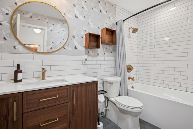 full bath with shower / bath combo with shower curtain, toilet, tile walls, wallpapered walls, and vanity