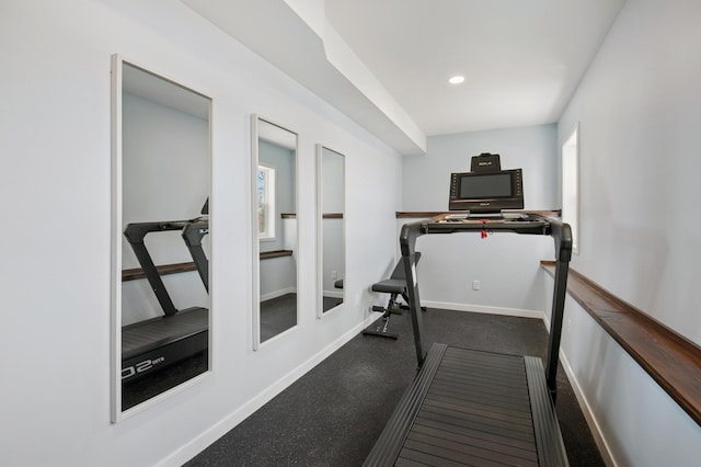 workout room with recessed lighting and baseboards