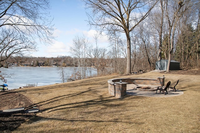 water view with a fire pit